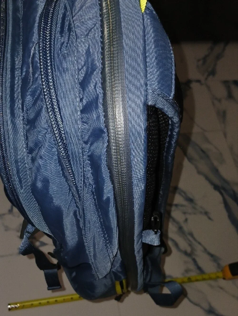 The North Face Navy Blue Backpack with Yellow Accents